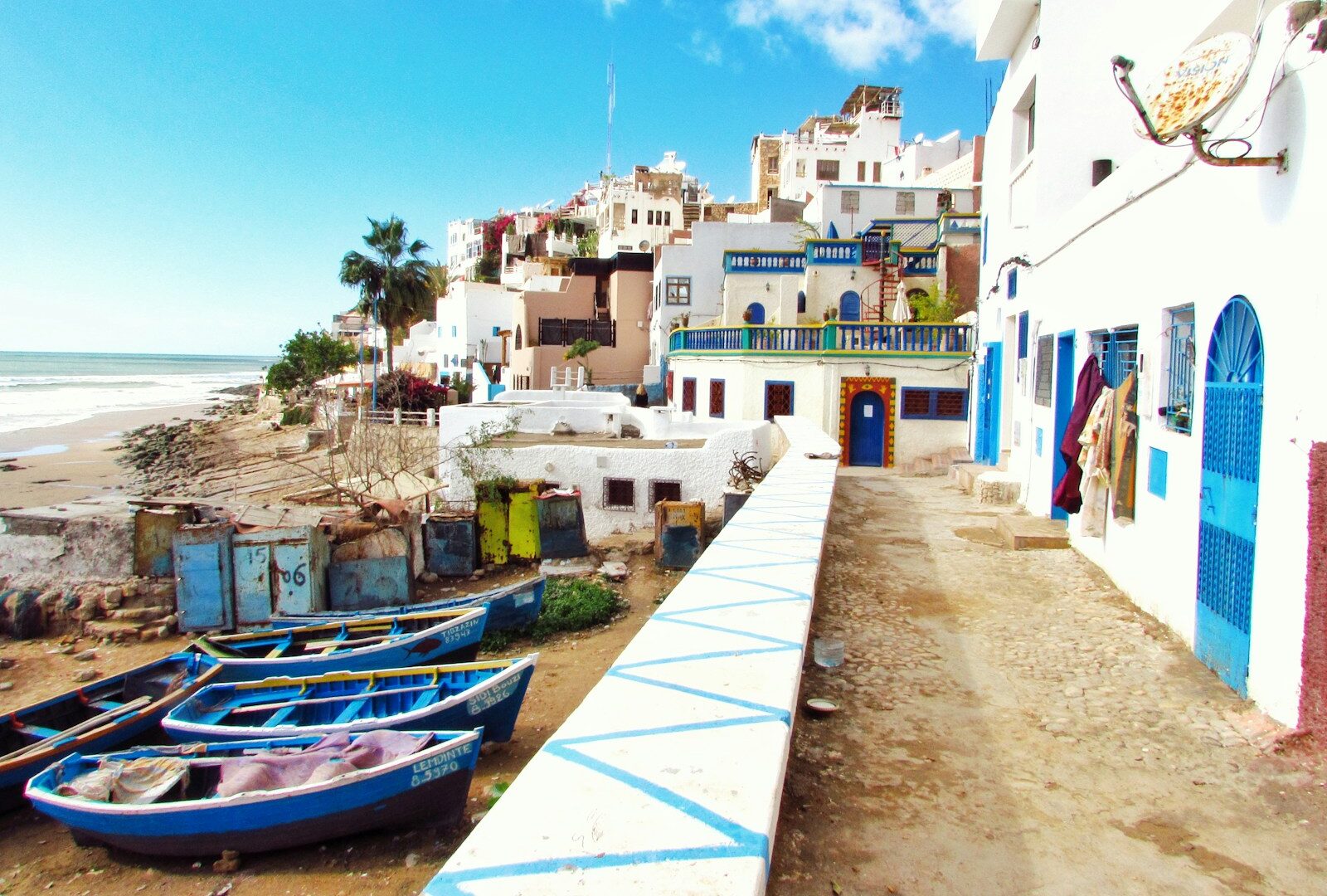 boatd docked near houses and body of water